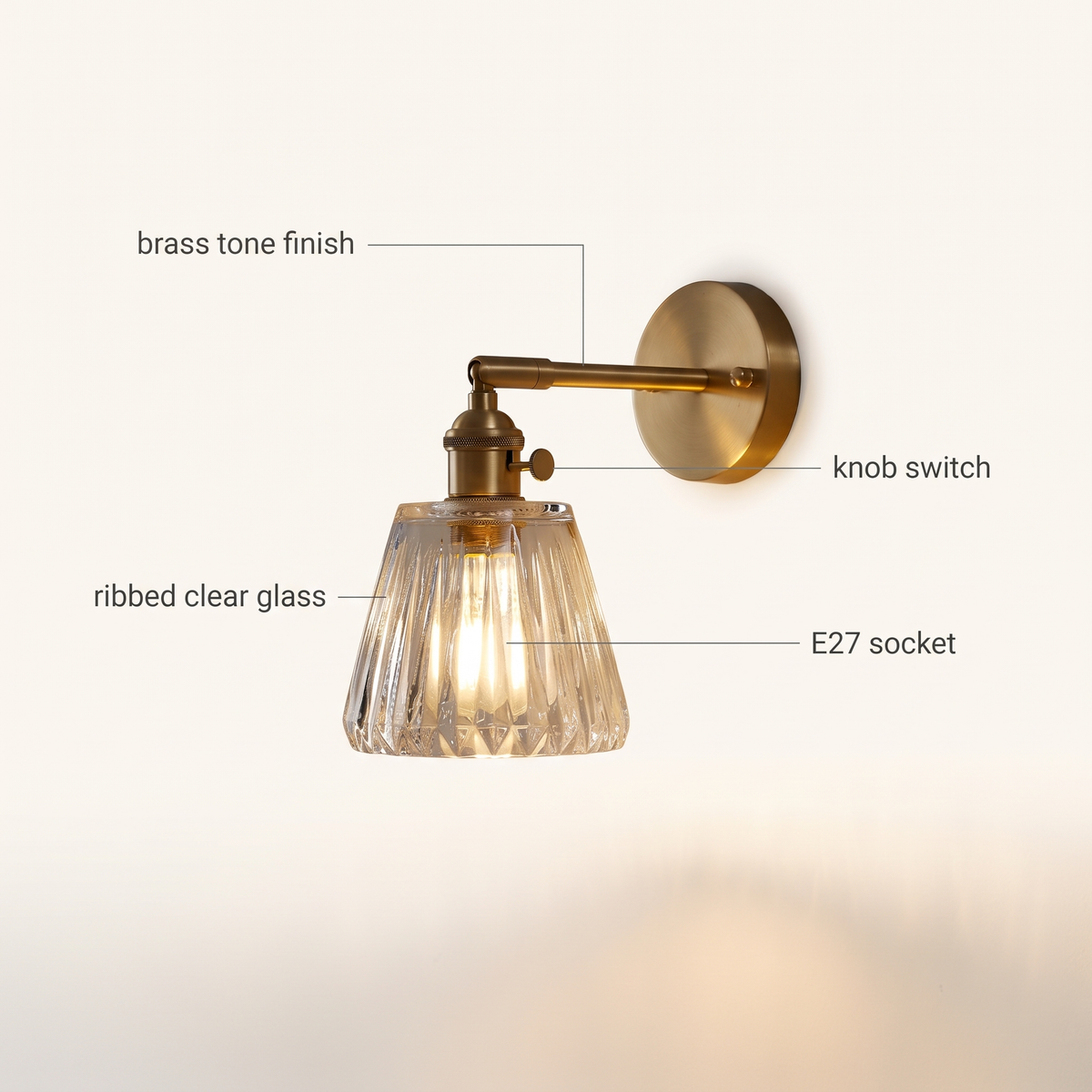 Brass Ribbed Glass Wall Sconce features