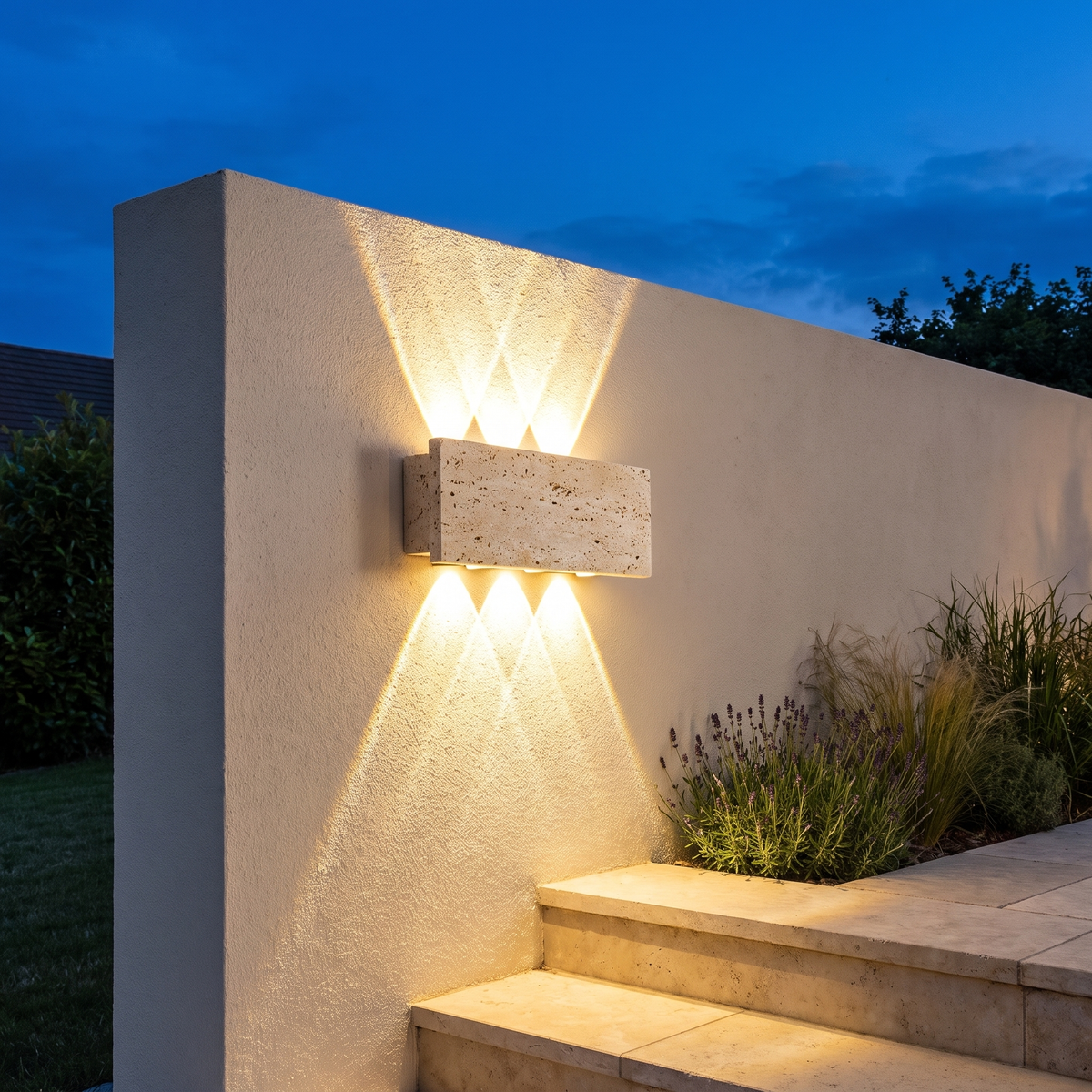 Stone outdoor wall light on a garden wall